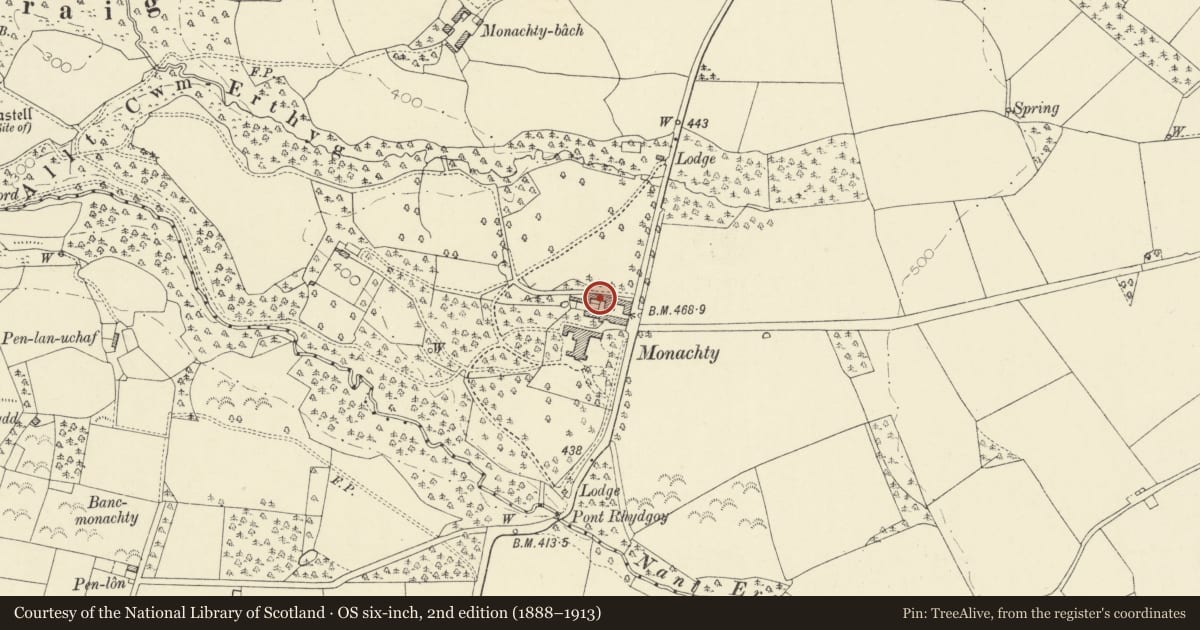 Ordnance Survey six-inch map, 2nd edition (1888–1913) covering the location of L-plan ranges on N and W sides of farmyard at Monachty, Dyffryn Arth, Ceredigion, with a pin at the register's coordinates