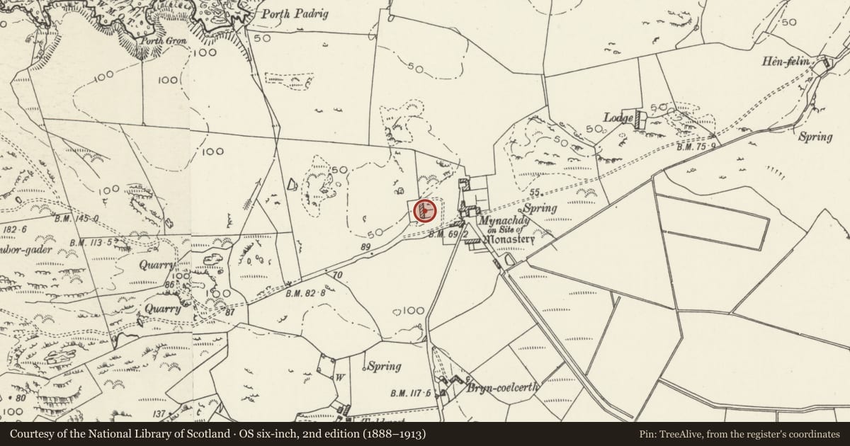 Ordnance Survey six-inch map, 2nd edition (1888–1913) covering the location of Cornbarn-cowhouse range at Mynachdy, Cylch-y-Garn, Isle of Anglesey, with a pin at the register's coordinates