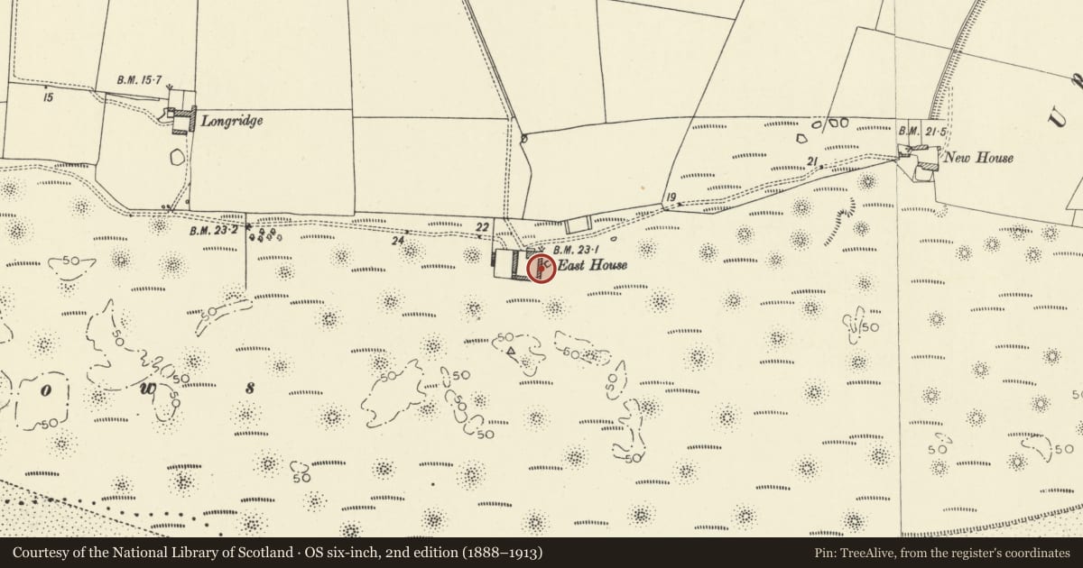Ordnance Survey six-inch map, 2nd edition (1888–1913) covering the location of East farm-range at East House Farm, Laugharne Township, Carmarthenshire, with a pin at the register's coordinates