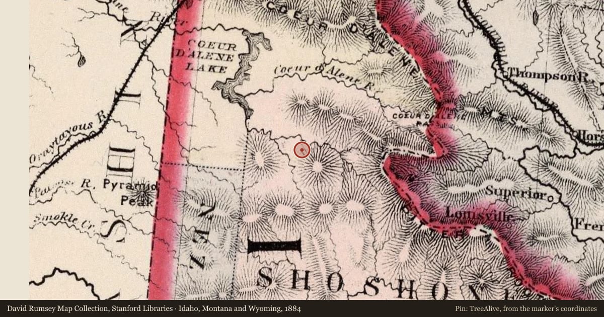 Idaho, Montana and Wyoming, 1884, covering the location of Wallace, with a pin at the marker's coordinates